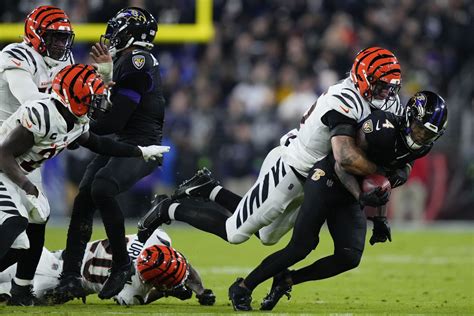 Ravens handle Bengals 34-20 after Joe Burrow exits in the 2nd quarter with a wrist injury